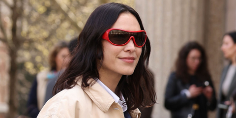 Alexa Chung was seen wearing red Miu Miu MU B14SU 27N80Q Ivresse shield sunglasses at the Miu Miu Fall/Winter 2026 fashion show during Paris Fashion Week.
