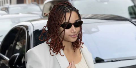 Amandla Stenberg was seen wearing Prada PR 26ZS 14L09Z sunglasses in honey tortoiseshell during Milan Fashion Week Fall/Winter 2024