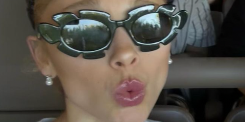 Ariana Grande wearing Loewe Paula's Ibiza flower sunglasses in green on Instagram post