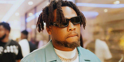 BNXN (formerly Buju) was seen wearing black and white Prada PR 06YS 09Q5S0 sunglasses