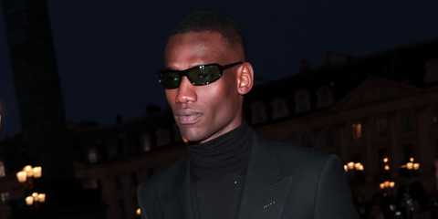 Muay Thai artist Bampara Kouyate was seen wearing black Tom Ford Addison-02 TF1400 01N sunglasses with green lenses at the Tom Ford Fall/Winter 2026 fashion show during Paris Fashion Week.