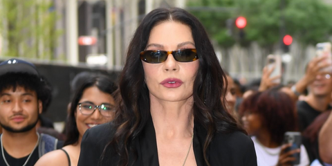 Catherine Zeta-Jones was seen wearing tortoiseshell Saint Laurent Sun SL 557 Shade 002 slim sunglasses at the Netlix's Wednesday Season 2 promo tour in New York City, August 2025. Shop online now on Pretavoir
