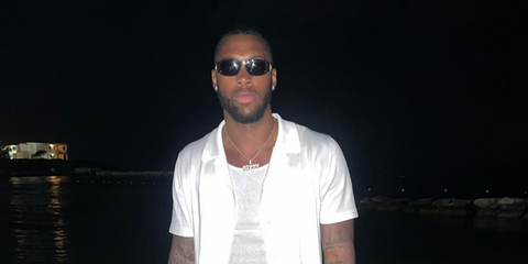American football athlete Hassan Haskins was seen wearing black Versace 4361 GB1/87 Medusa Biggie Sunglasses in his Instagram post