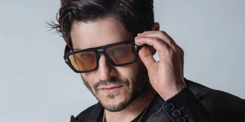 Welsh actor Iwan Rheon was seen wearing black Tom Ford Redford TF1153 01E sunglasses with yellow lenses in a Cliche Mag feature, September 2024.