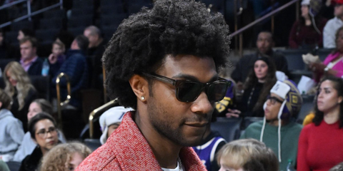 Actor Jonathan Daviss was seen wearing black Prada PR A17S 16K731 square sunglasses at a basketball game between the Los Angeles Lakers and the Houston Rockets in December 2025.
