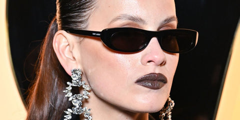 Spanish actress Milena Smit was seen wearing black Saint Laurent Sun SL 557 Shade 001 sunglasses at the Saint Laurent Fall/Winter 2024 fashion show during Paris Fashion Week