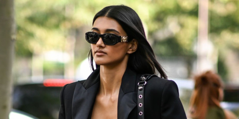 British model Neelam Kaur Gill was seen wearing black Versace 4361 GB1/87 Medusa Biggie Sunglasses during Paris Fashion Week. Shop online now on Pretavoir