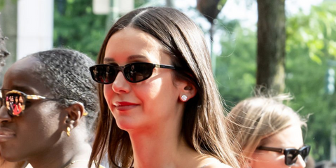 Actress Nina Dobrev was seen wearing black Miu Miu MU A06S 16K08Z sunglasses at the "Happy Hours" premiere during Tribeca Film Festival 2026.