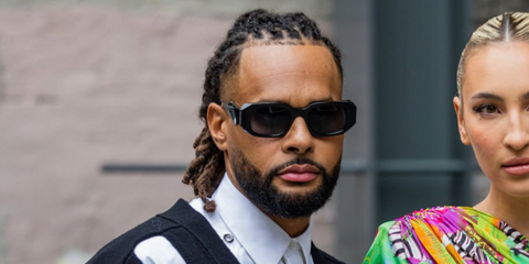 Basketball player Patty Mills was seen wearing black Prada PR 17WS 1AB5S0 Symbole Sunglasses during New York Fashion Week season Spring/Summer 2024