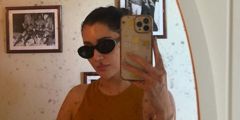 Praya Lundberg is seen wearing Saint Laurent Sun SL M136 001 oval sunglasses in her Instagram post