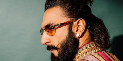 Bollywood actor Ranveer Singh was seen wearing gold Prada PR 65ZS ZVN70L round sunglasses in his Instagram post