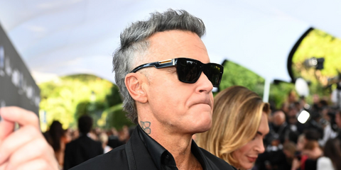 Robbie Williams was seen wearing black Dolce&Gabbana DG4465 501/87 square sunglasses at amfAR Gala during Cannes Film Festival 2026.