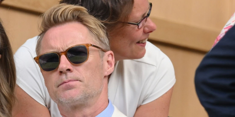 Ronan Keating was seen wearing transparent yellow Montblanc MB0006S 004 square sunglasses with blue lenses at the Wimbledon Tennis Championships 2026.