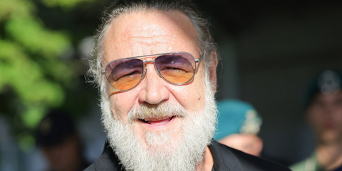 Russell Crowe was seen wearing silver Prada PR A54S 27506Z aviator sunglasses with blue to yellow gradient lenses at the 83rd Venice Film Festival, September 2026.
