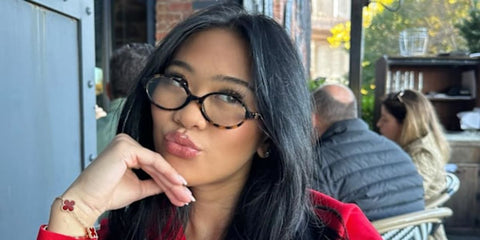 Olympic gymnast Suni Lee was seen wearing tortoiseshell Miu Miu MU 04ZS VAU08N Blue Control round optical glasses