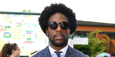Actor Tosin Cole was seen wearing black Polo Ralph Lauren PH4110 5284/87 round sunglasses at the Wimbledon Tennis Championship 2025.