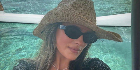Fitness influencer Whitney Simmons was seen wearing black Prada PR 26ZS 16K08Z sunglasses in her Instagram post, April 2024. Shop online now on Pretavoir