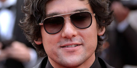Will Sharpe was seen wearing black and gold Akoni Spitzer AKS 525A sunglasses at the Fatherland red carpet screening during Cannes Film Festival 2026.