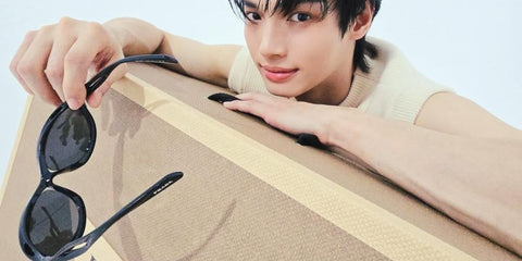 Thai actor Win Metawin was seen wearing black Prada PR A26S 1AB60G Men's Morph cat eye sunglasses in his Instagram post